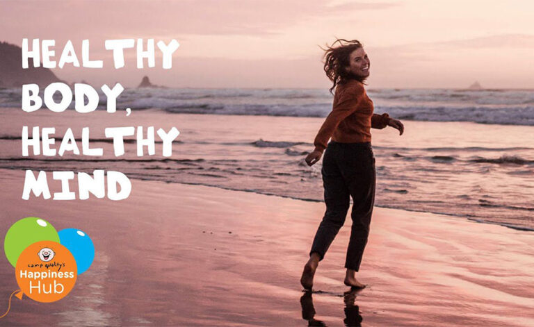 Healthy body, healthy mind. Girl running towards the water on a beach while smiling at the camera