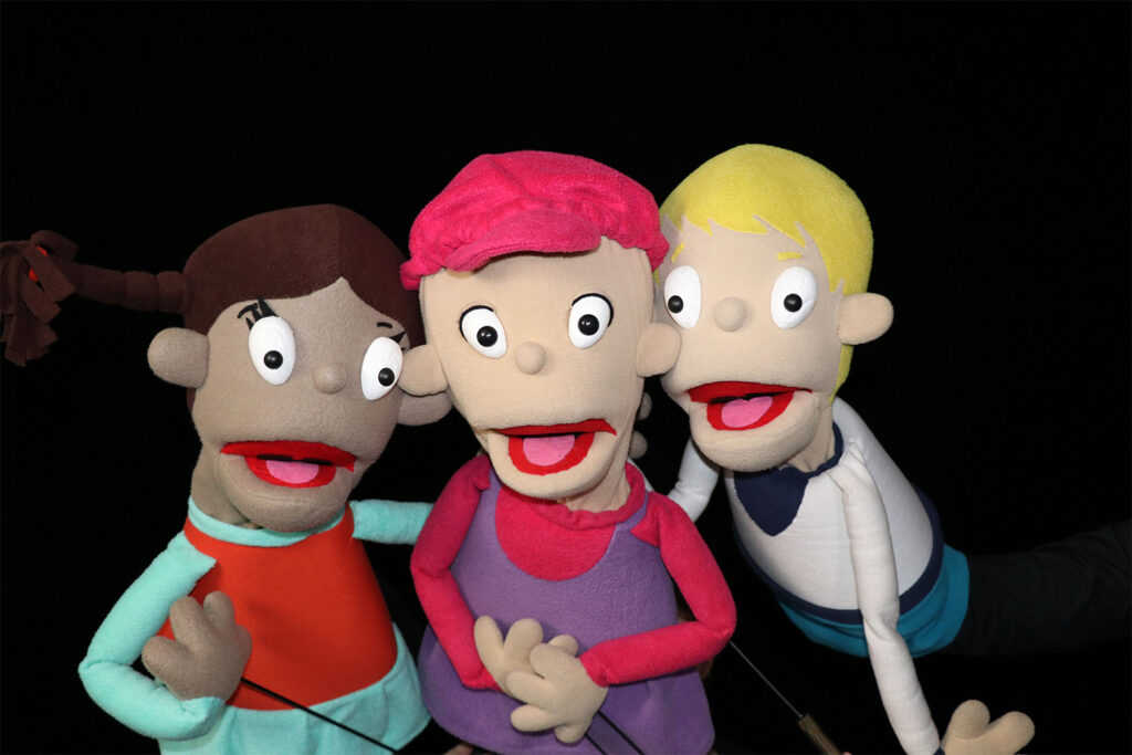 Camp Quality Puppets together with black background