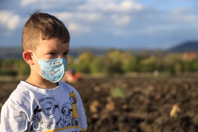 A child in a face mask