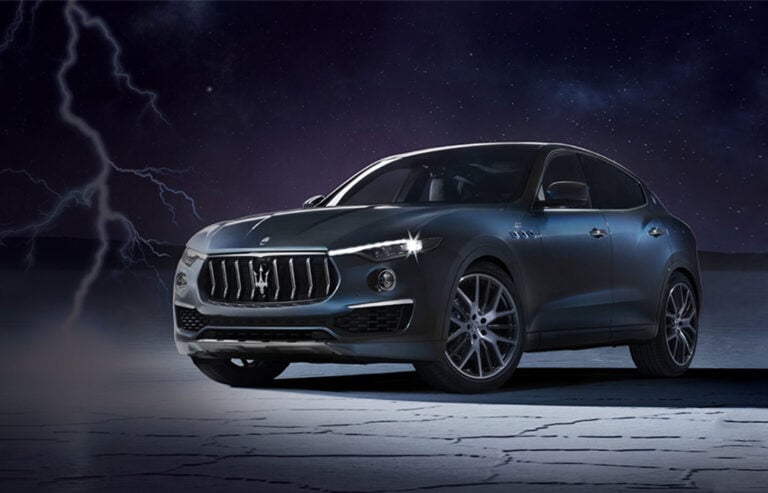 A Maserati Levante with lightning in the background