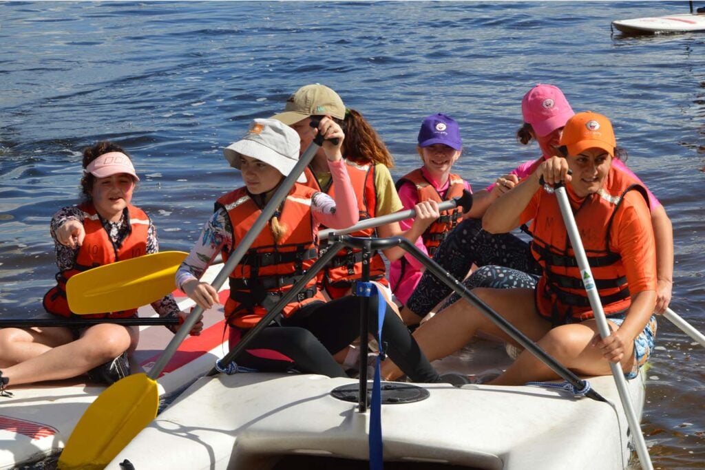 Camp Quality kids rowing a kayak