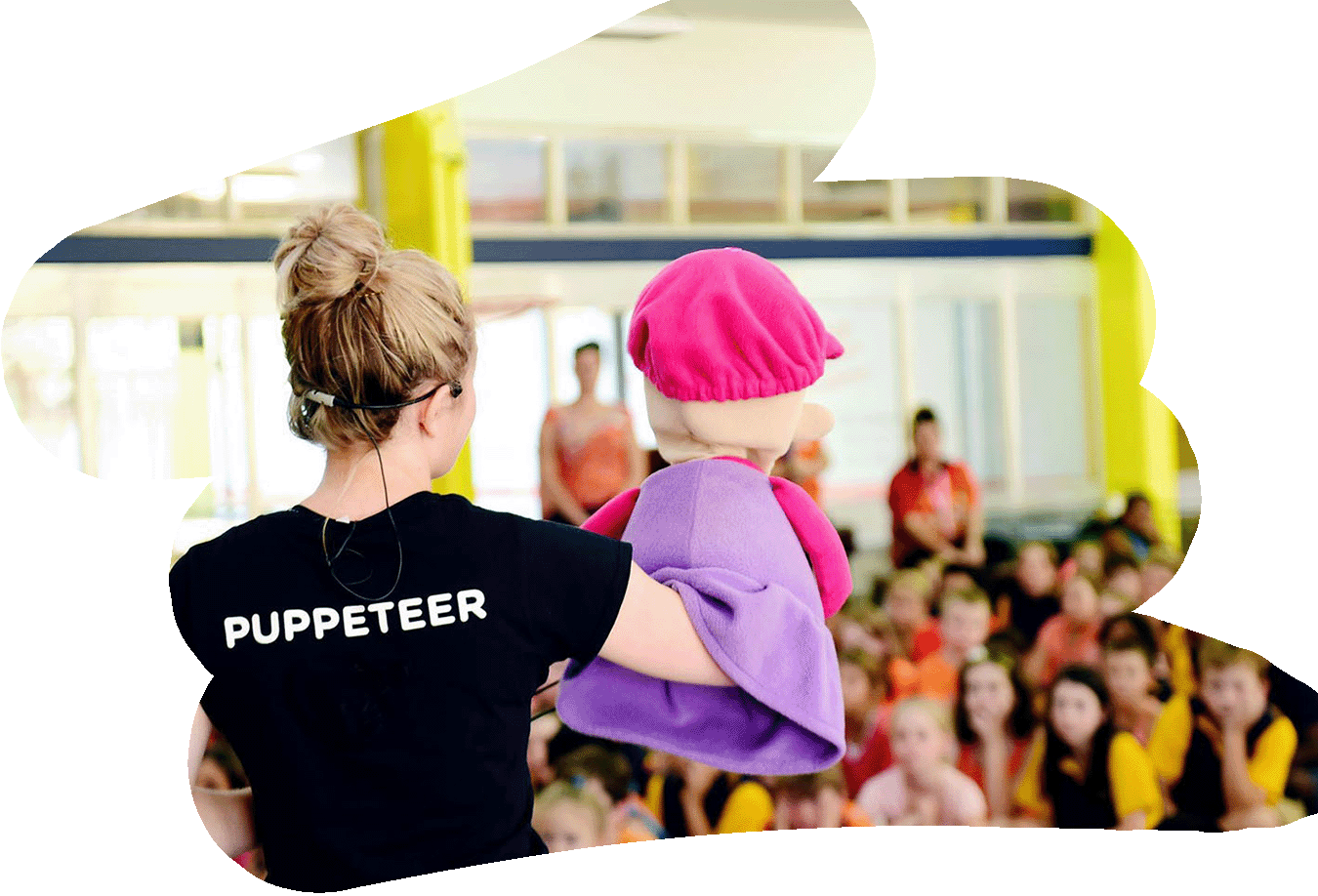 A Camp Quality puppeteer performs a cancer education puppet show at a school