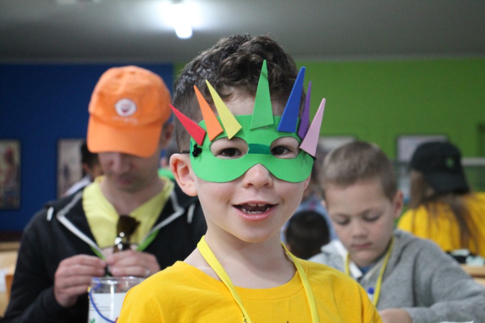 Boy with colourful superhero mask