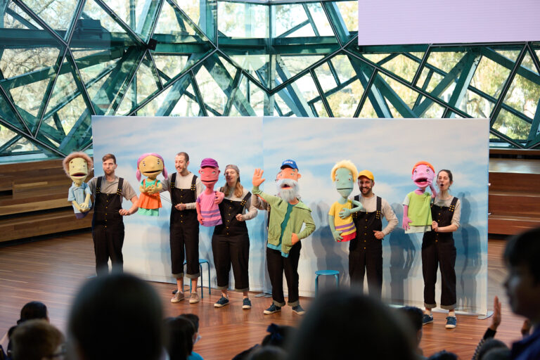 6 Puppets in front of an audience