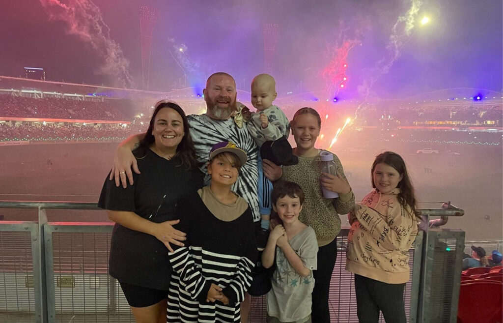 Bobby's family with fireworks in the background