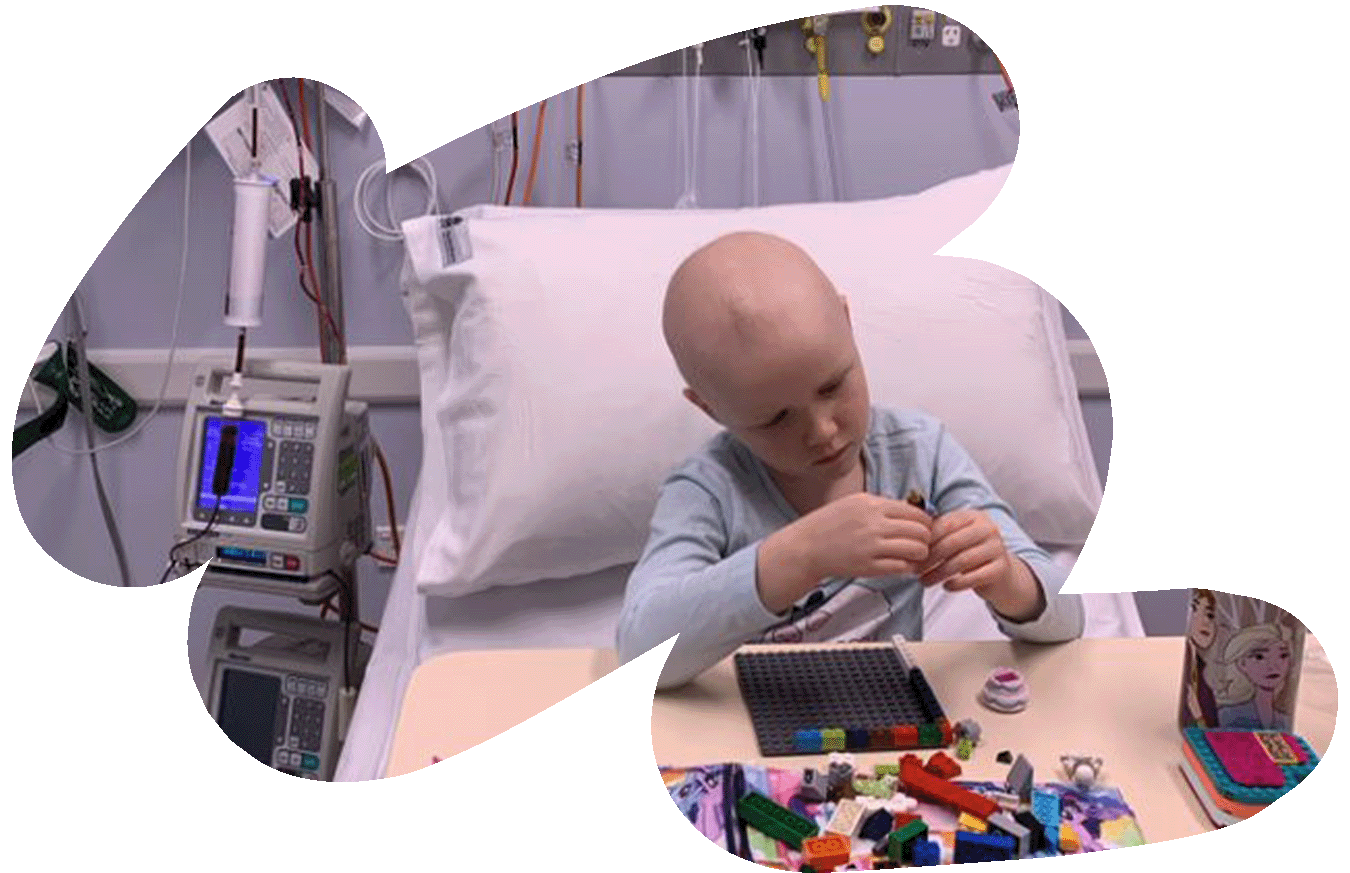 Child in hospital playing with lego